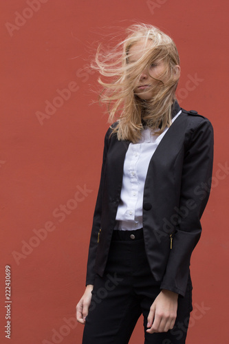 Portrait of a young smiling woman isolated on background with copy space