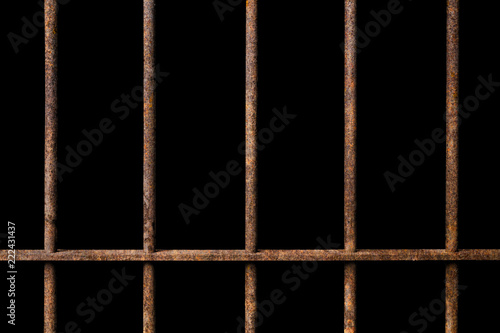 Old prison rusted metal bars cell lock on black background, concept of strengthen and protect