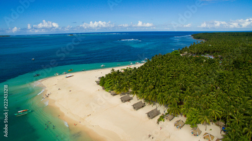 dako island pacific ocean palm trees sandy beach canoes surf