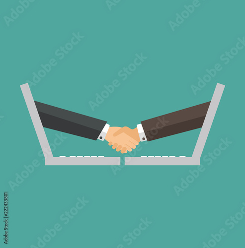 Businessmen shaking hands through a laptop screen
