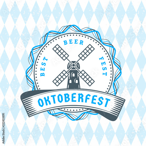 Beer festival Oktoberfest celebrations. Vintage beer badge on the traditional Bavarian linen flag background