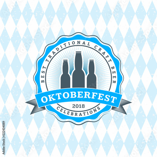 Beer festival Oktoberfest celebrations. Vintage beer badge on the traditional Bavarian linen flag background