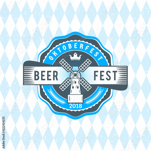 Beer festival Oktoberfest celebrations. Vintage beer badge on the traditional Bavarian linen flag background
