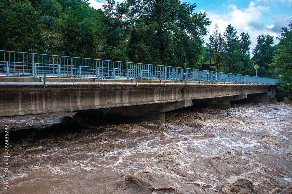 bridge over a stormy river