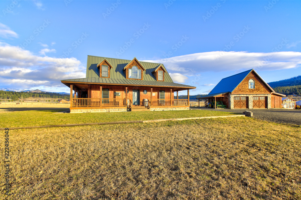 Nice wooden ranch home with beautiful landscape in the countryside. Nice wooden ranch home with beautiful landscape in the countryside.