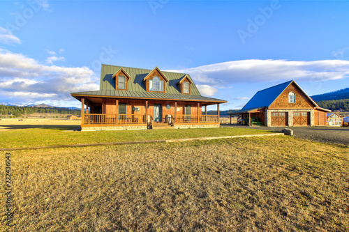 Nice wooden ranch home with beautiful landscape in the countryside.
