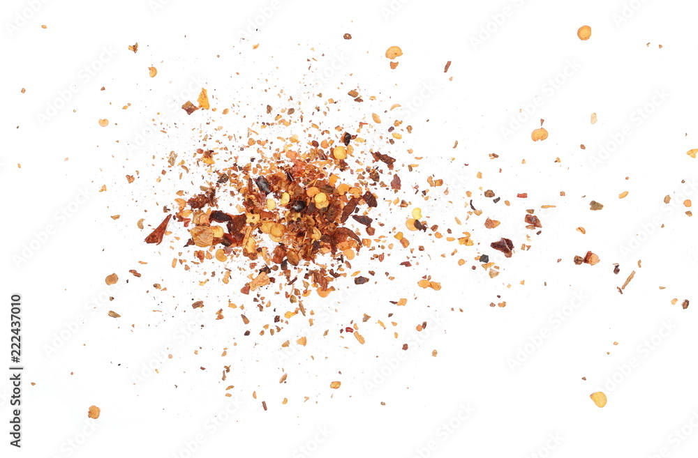 Crushed red cayenne pepper, dried chili flakes and seeds pile isolated on white background, top view Crushed red cayenne pepper, dried chili flakes and seeds pile isolated on white background, top view