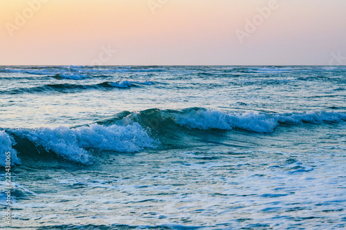 Ocean waves in sunset ligth
