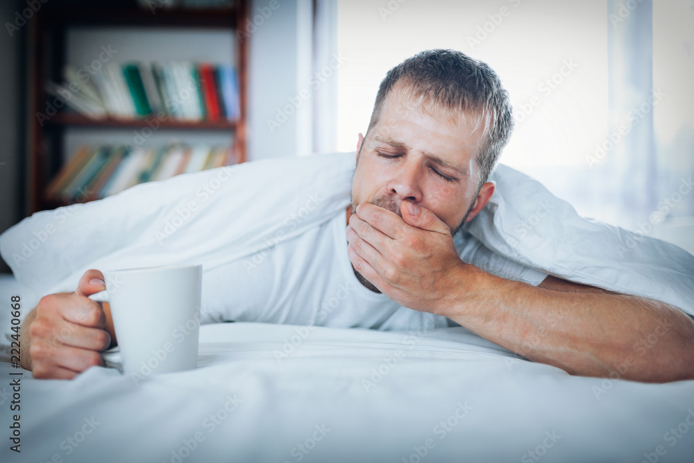 Man trying to wake up in the morning Man trying to wake up in the morning