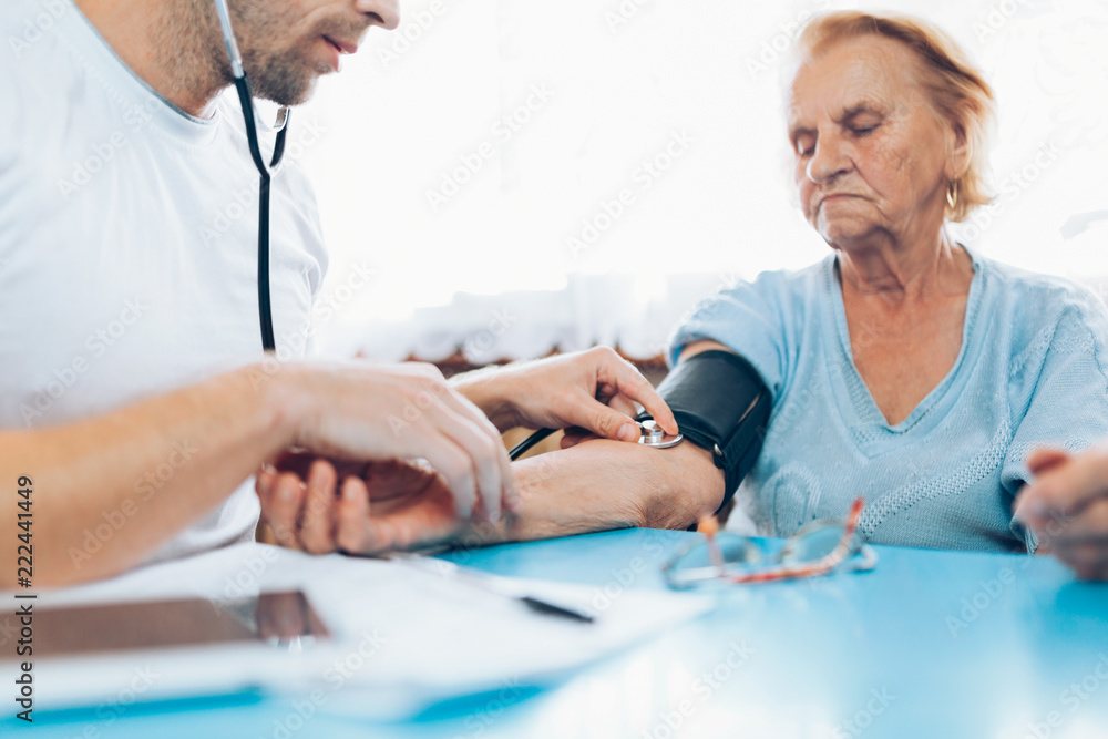 Senior woman during a medical exam with practitioner Senior woman during a medical exam with practitioner