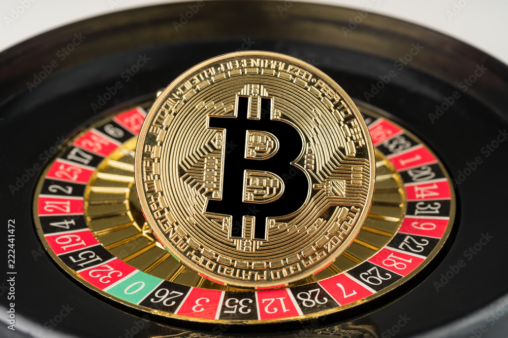 Gold physical Bitcoin coin on casino roulette. Crypto currency market gambling abstract concept. Gold physical Bitcoin coin on casino roulette. Crypto currency market gambling abstract concept.