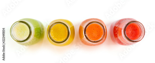 Colourful smoothie juice bottles isolated on white background