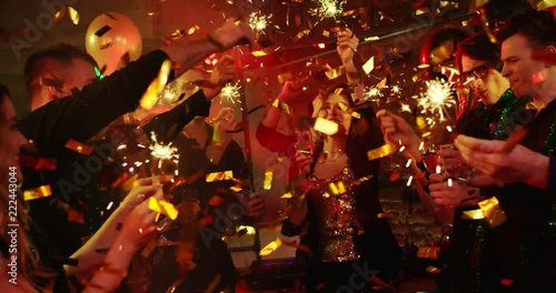 Happy New Year. Young people are firing bengal lights at a nightclub. They are celebrating New Year and Christmas