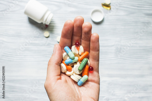 Colorful pills and medicines in the hand