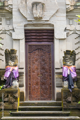 Traditional Balinese statue protecting from evil spirits demon at the entrance