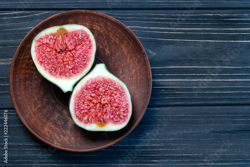 fruits of figs on a black wood background