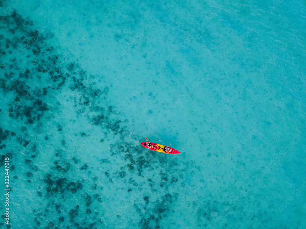 Kayaking on a crystal clear water in Koh Phi Phi, Thailand - Drone photography