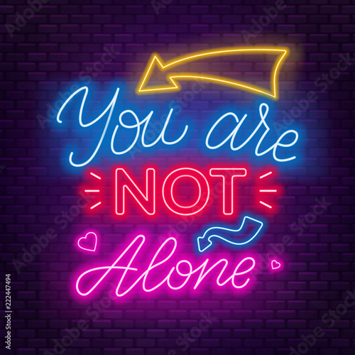 Neon lettering you re not alone. Motivational quote.