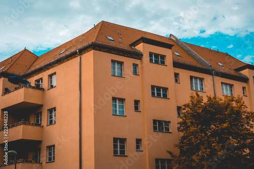 orange facaded gdr building in the heart of east berlin