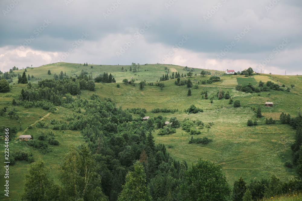 cloudy summer landscape of Carpathian mountains, meadows and sky. Ukraine