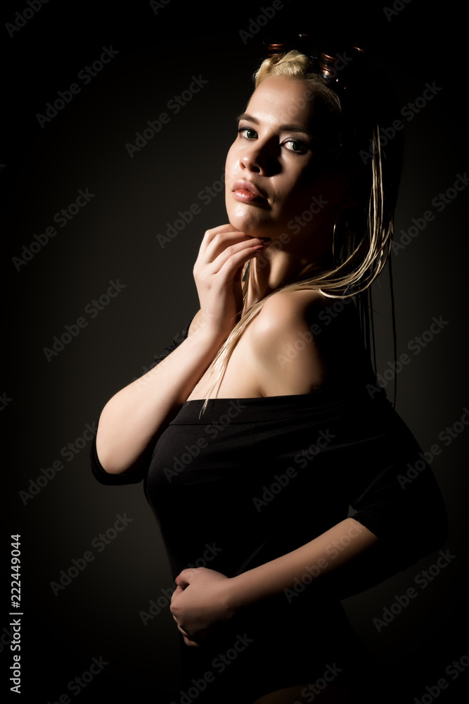 sexy blonde woman with dreadlocks and welding glasses on a dark background in the studio sexy blonde woman with dreadlocks and welding glasses on a dark background in the studio