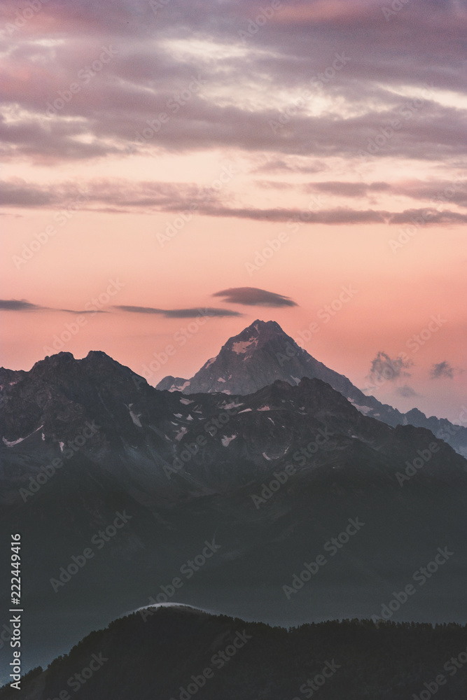 Caucasus mountains peaks and clouds sunset Landscape Summer Travel wild nature scenic aerial view .