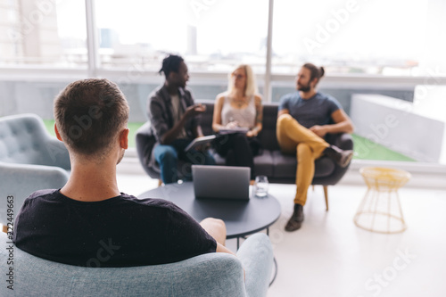 group of business people having conersation in office photo