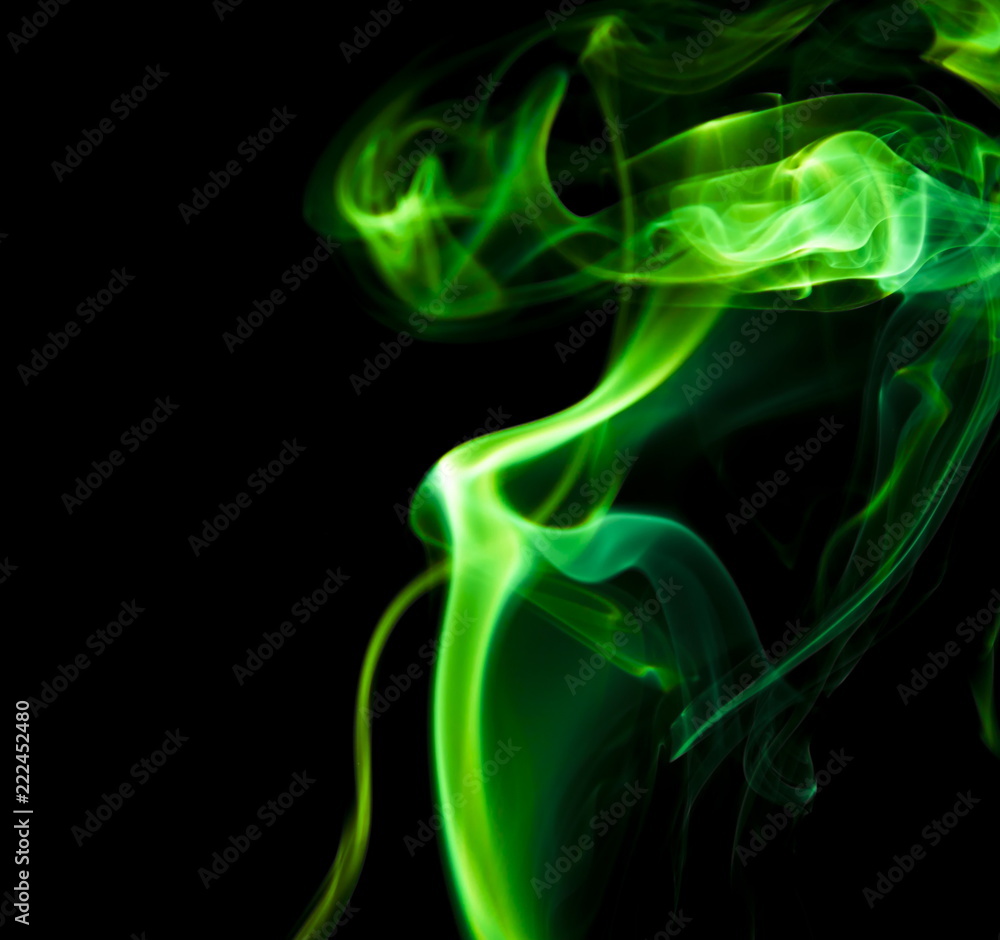 Green smoke on black background Green smoke on black background
