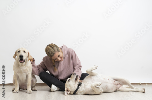 Girl with labrador dogs