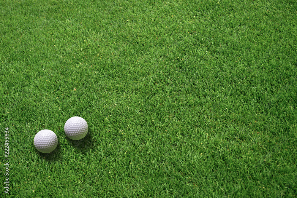 Top View of Two White Golf Balls Lying on Green Grass Top View of Two White Golf Balls Lying on Green Grass