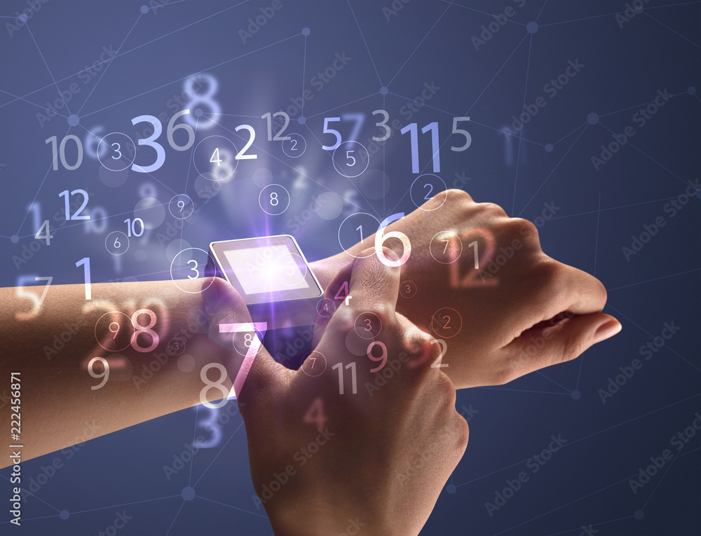 Close up female naked hand wearing smartwatch and numbers around Close up female naked hand wearing smartwatch and numbers around