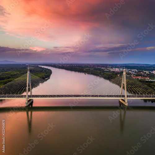 Canvas Print Budapest, Hungary - Aerial view of Megyeri Bridge over River Danube at sunset wi