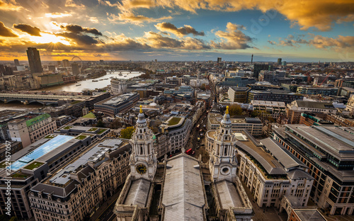 London, England - Panoramic aerial skyline view of London taken from the top of St.Paul's Cathedral at sunset with dramatic clouds