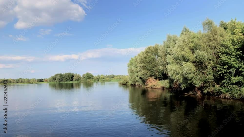 View from small boat moving along the Volga river in Russia, Summer 2018 View from small boat moving along the Volga river in Russia, Summer 2018