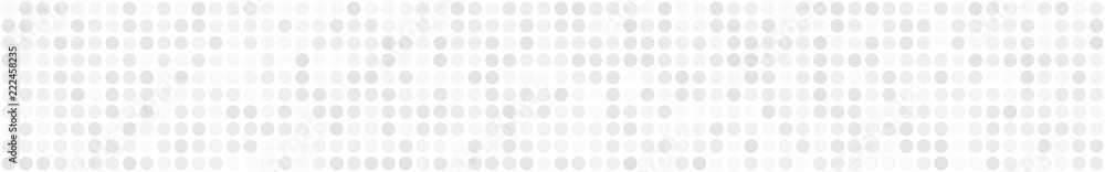 Abstract horizontal banner or background of small circles or pixels in white colors.