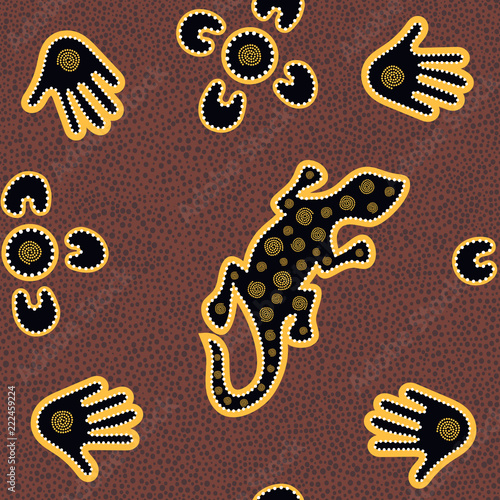 Australian aboriginal seamless vector pattern with dotted circles, lizard, palms, boomerangs and spirals