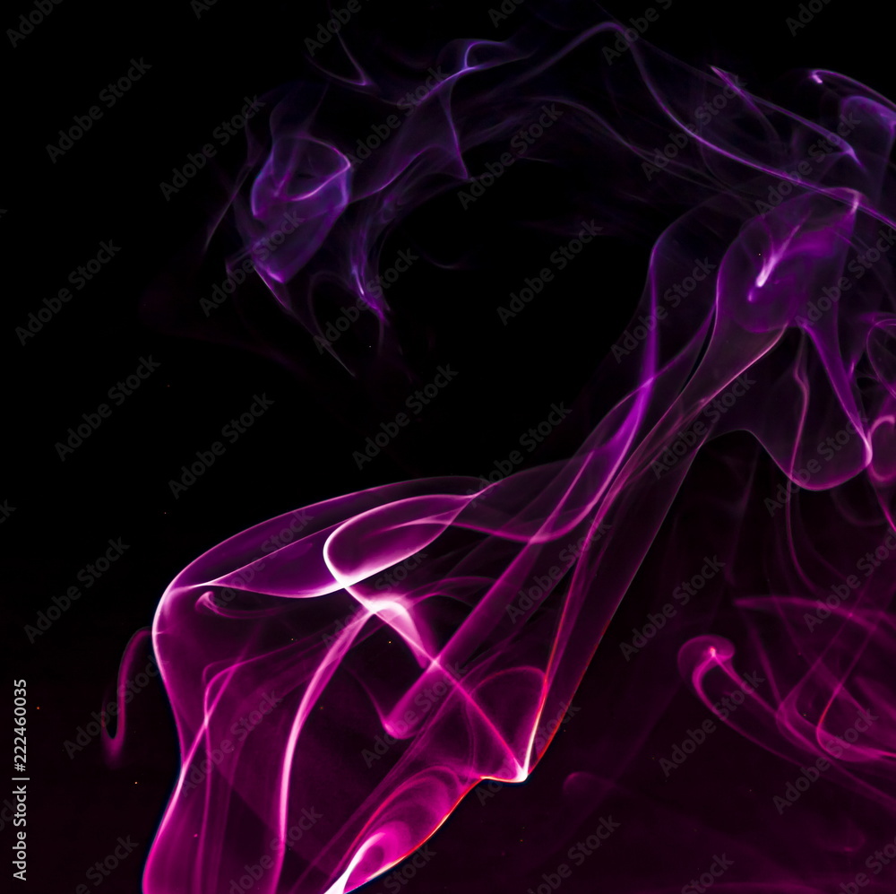 Fototapeta premium Colored smoke on black background