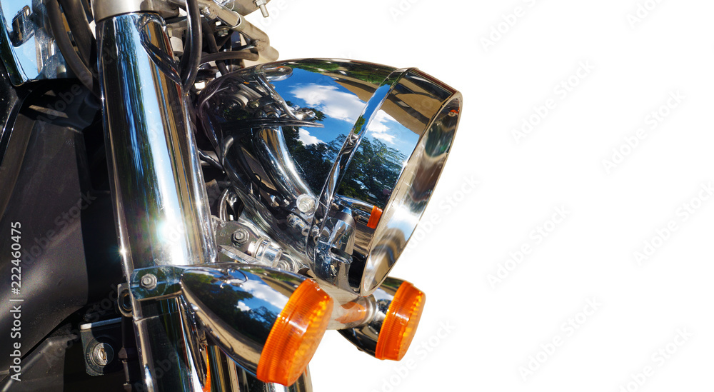 Motorcycle. close-up on its front part: reflector and blinkers.