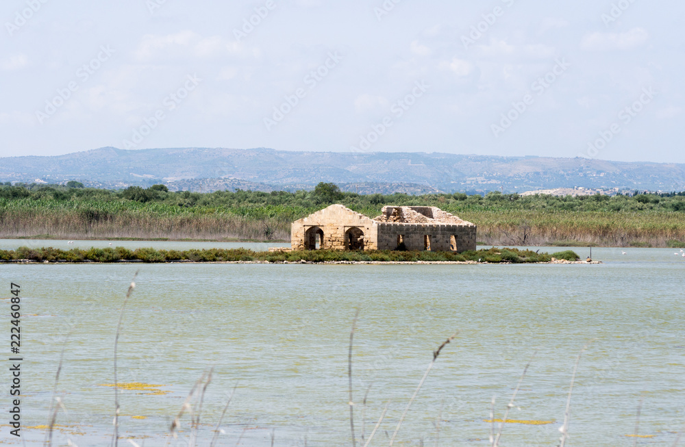 Beautiful mediterranean landscape in the natural reserve of Vendicari. A gorgeous and peaceful place in Sicily (Italy) near Syracuse. Here a water pond where many bird species live Beautiful mediterranean landscape in the natural reserve of Vendicari. A gorgeous and peaceful place in Sicily (Italy) near Syracuse. Here a water pond where many bird species live