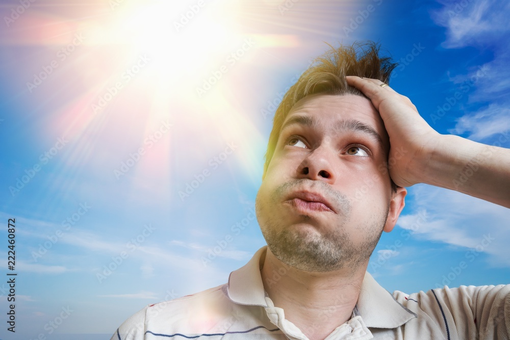 Young man is sweating. Hot weather concept. Sun in background. Photos |  Adobe Stock