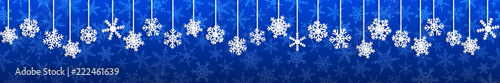 Christmas seamless banner with white hanging snowflakes with shadows on blue background