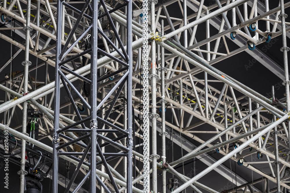 Background of metal construction of a portable concert stage with illuminators.