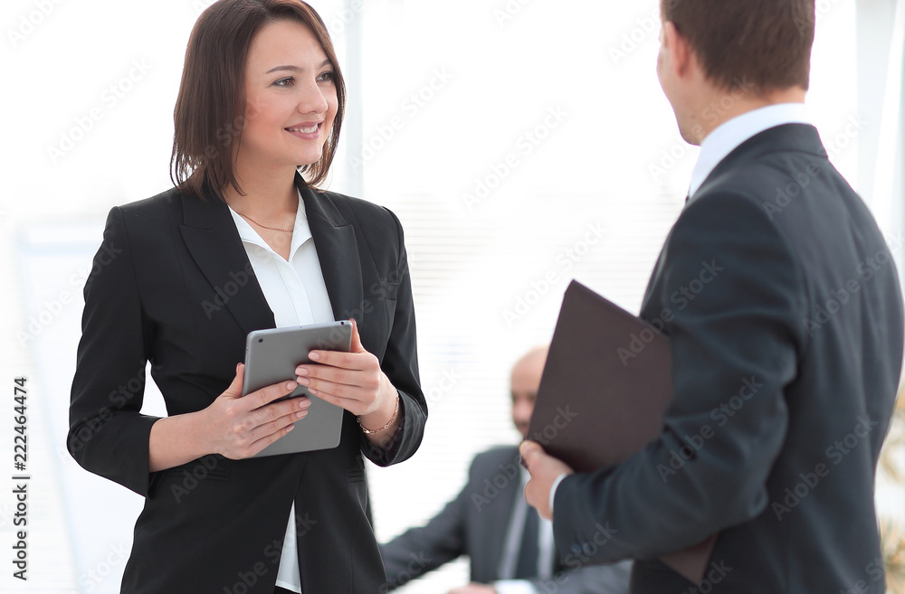business colleagues discussing work issues at the office business colleagues discussing work issues at the office