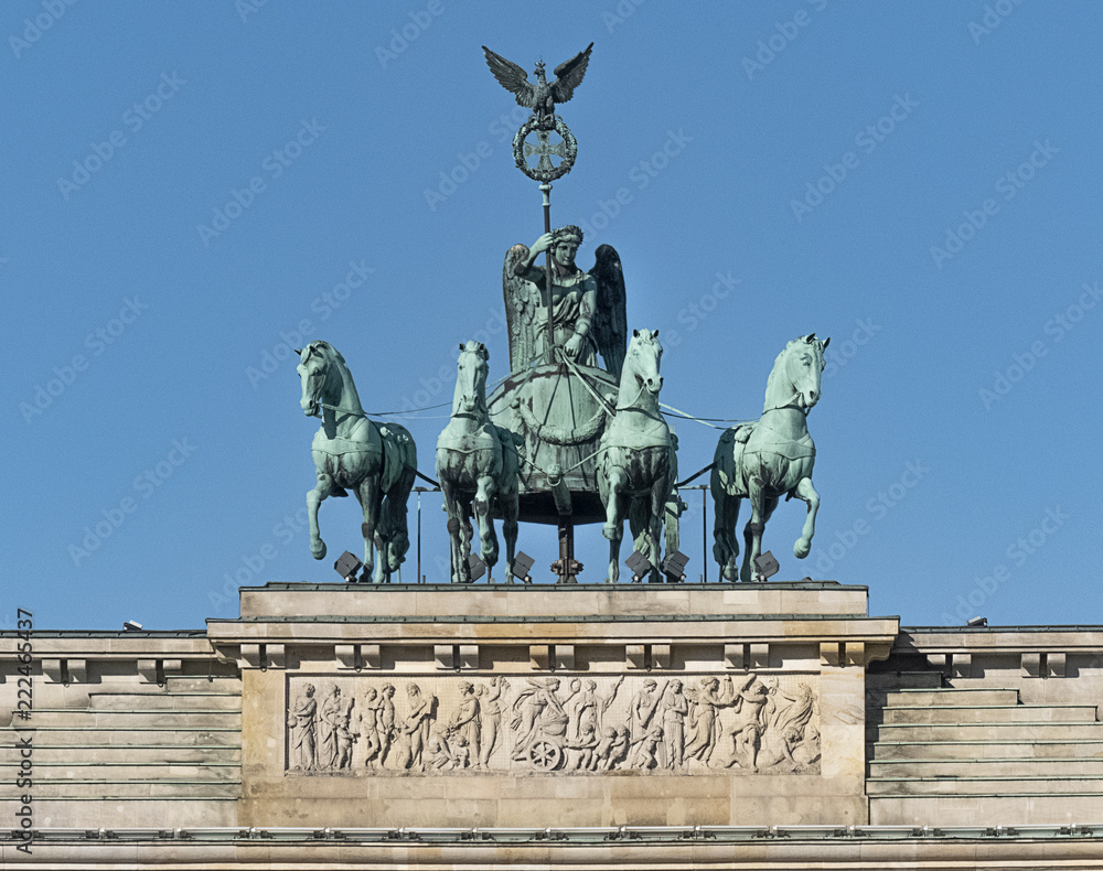 Quadriga on top of Brandenburg Gate in clear blue sky