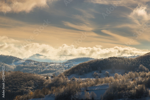 Winter scenery with fresh snow, and storm clouds, in the Transylvanian Alps