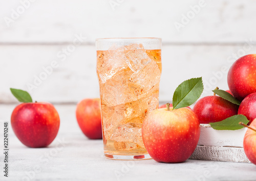 Stampa su tela Glass of homemade organic apple cider with fresh apples in box on wooden background