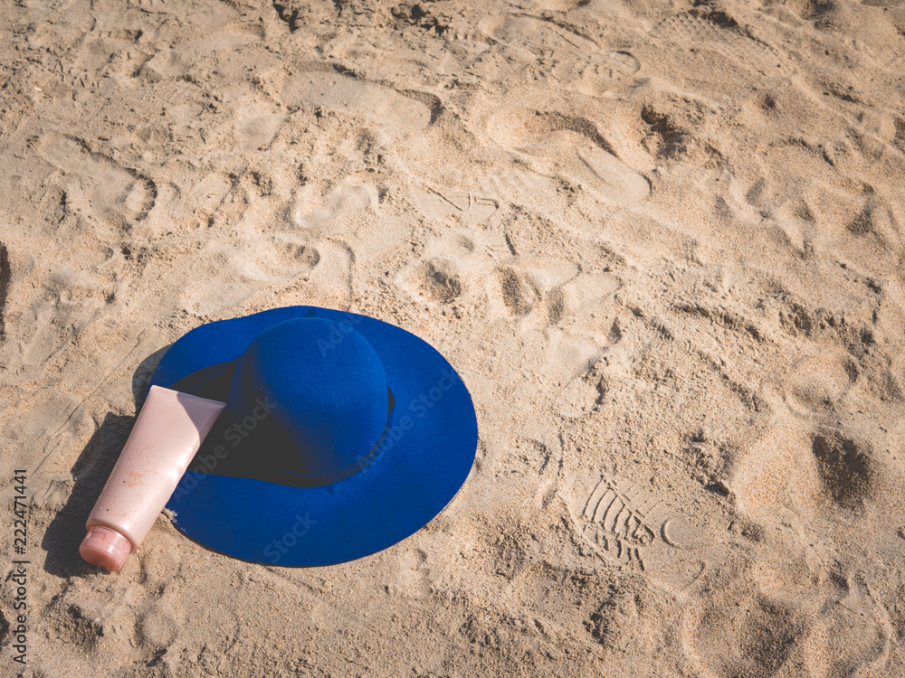 Sunscreen, hat On the beach in summer. Sunscreen, hat On the beach in summer.