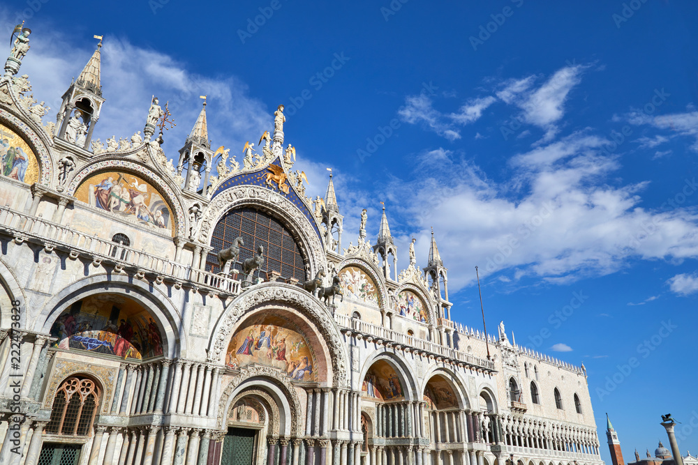 San Marco basilica facade in Venice, blue sky in a sunny day in Italy