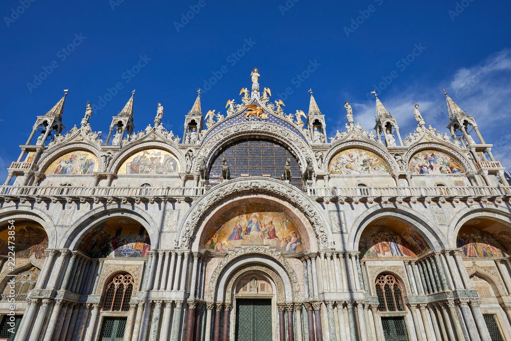 Saint Mark low angle view basilica facade in Venice, blue sky in a sunny day in Italy