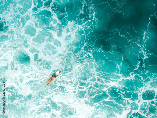 aerial shot leaky peak drone a-frame sumbawa surf ocean crystal white paddle girl